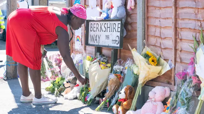 Children and neighbours have lain flowers and written touching tributes in chalk on the ground near the scene in Croydon.  	