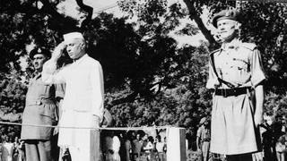 Jawaharlal Nehru salutes the flag as he becomes independent India’s first prime minister on August 15
