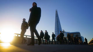 Commuters on London Bridge during the morning rush hour