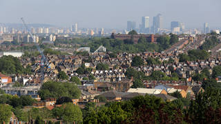A view of the City of London across houses