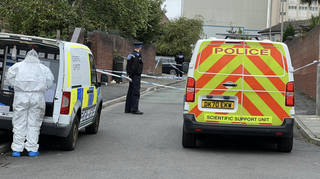 Police and forensics officers at the scene of the shooting in Toxteth
