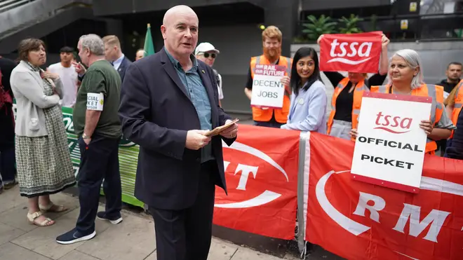 Mick Lynch, general secretary of the Rail, Maritime and Transport union, on the picket line outside London Euston train station