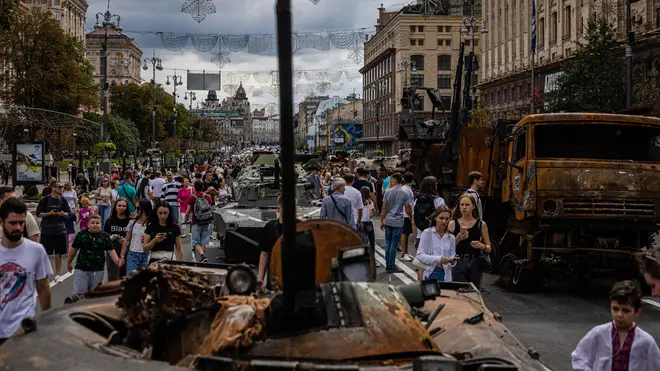 People look at destroyed Russian military equipment at Khreshchatyk Street