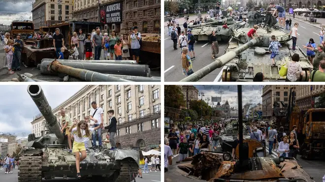 Locals climbed the destroyed Russian tanks on display.