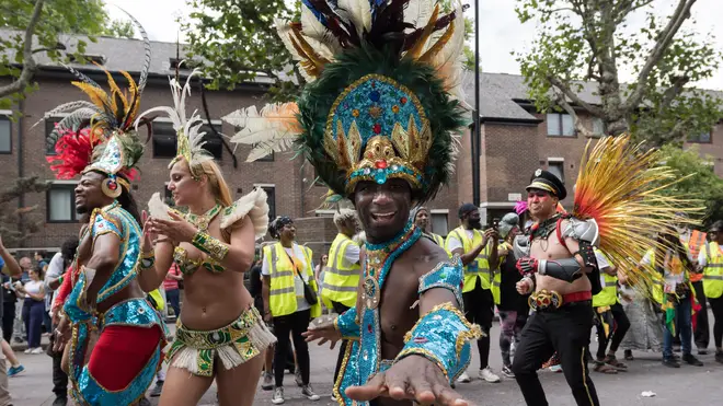 A man dances during the Grand Finale of the Notting Hill Carnival 