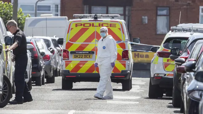 Police and forensic officers on Leinster Road in Old Swan, Liverpool.