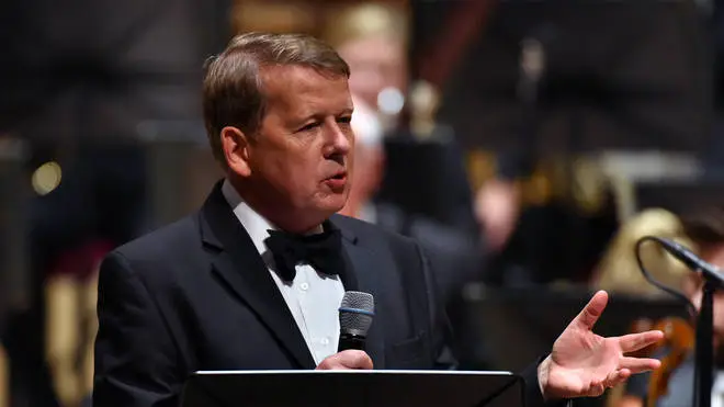 Bill Turnbull presents on stage with the Royal Liverpool Philharmonic Orchestra during Classic FM's 25th Birthday concert