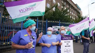 Unison members take part in a protest in Belfast