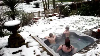 A family enjoying a hot tub
