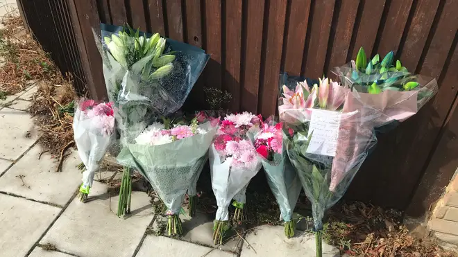Flowers have been left at the scene in tribute