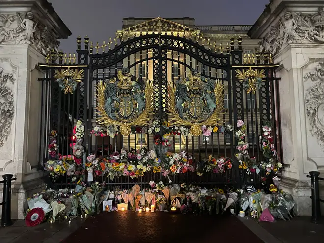 Tributes outside Buckingham Palace early on Friday morning