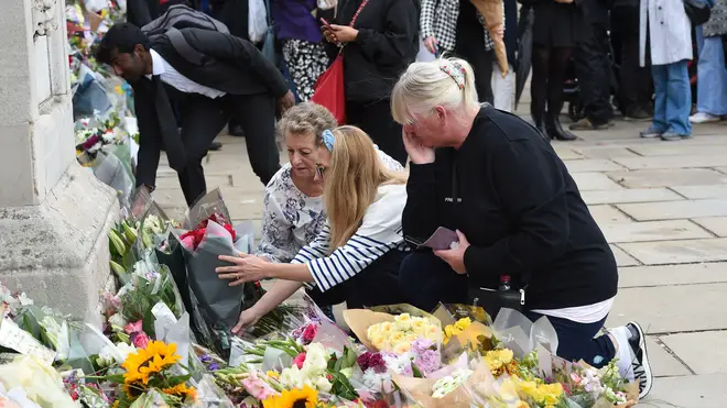 Tributes were left at Buckingham Palace on Friday