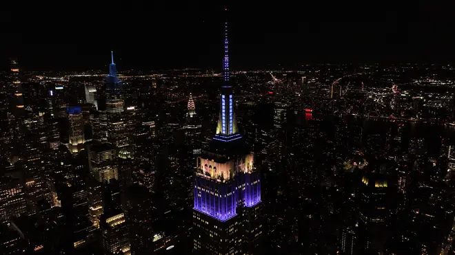 The Empire State Building in New York was lit up in purple to honour the monarch.