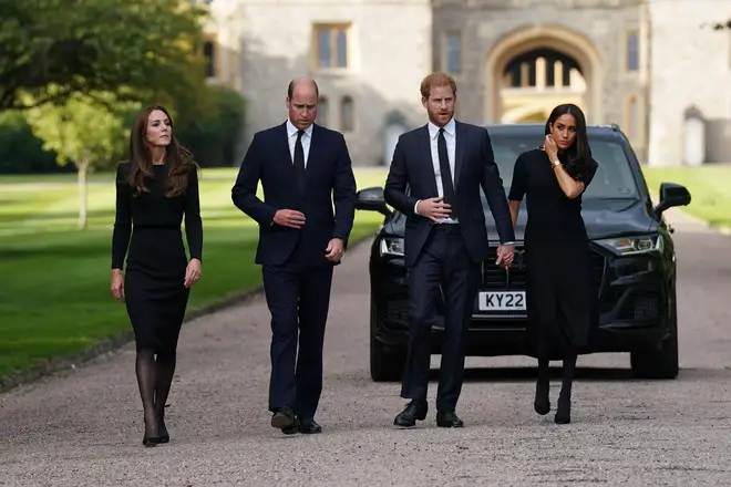 (L-R) Kate, William, Harry and Meghan arrive at Windsor castle to view tributes and greet well-wishers