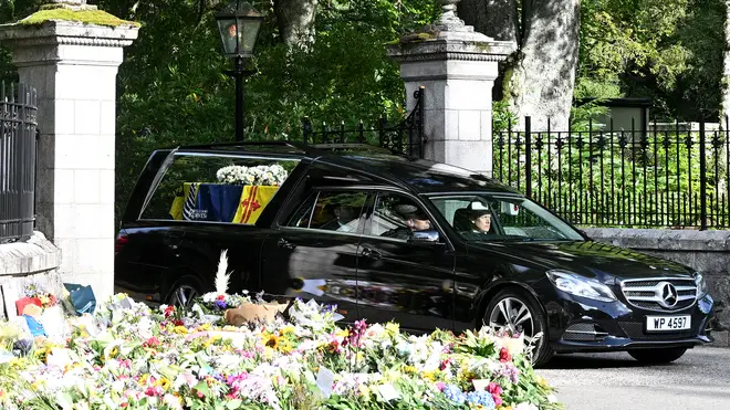 The coffin carrying the Queen leaves the gates of Balmoral