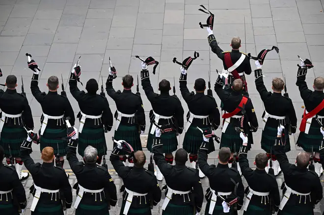 Members of the royal regiment of Scotland react outside of the St Giles' Cathedral in Edinburgh