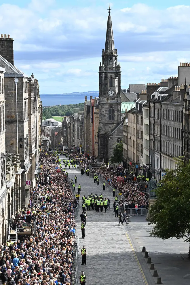 Crowds by St Giles Cathedral await the Queen's coffin before a vigil overseen by the King
