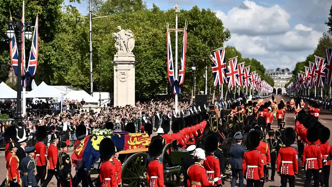 The Queen's coffin travels down the Mall on its way to Westminster Hall