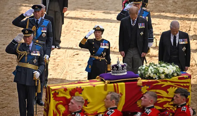 The Royal family salutes the Queen's coffin as it enters the Palace of Westminster