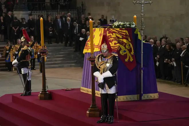 The first guard take their place as the Queen lies in state in Westminster Hall