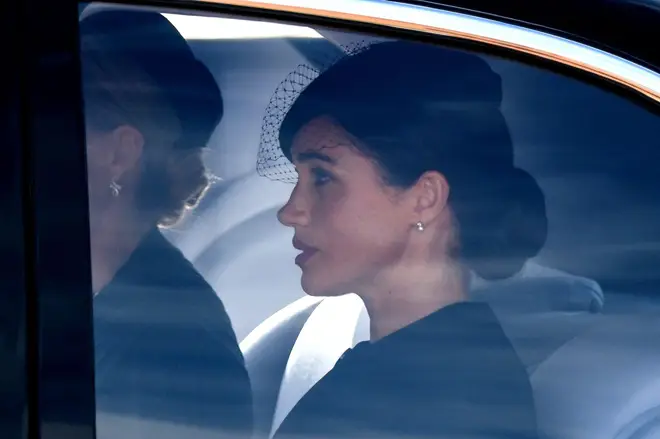 Meghan Markle follows in a car behind the Queen's coffin at today's service