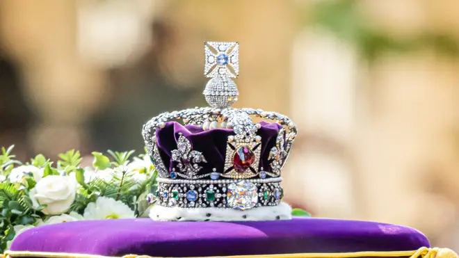 The wreath and Imperial State Crown atop the Queen's coffin