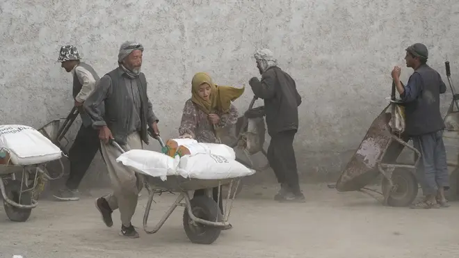 People receive food rations in Kabul, Afghanistan