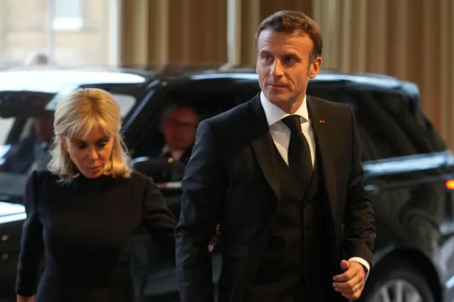 French President Emmanuel Macron and wife Brigitte Macron attend the reception
