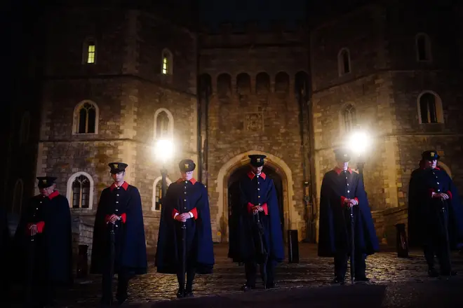 Castle Wardens observe the national minute's silence in memory of Queen Elizabeth II at Windsor Castle in Berkshire
