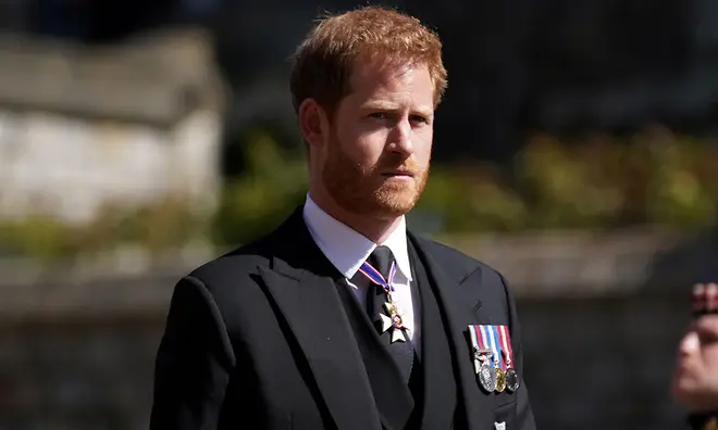 Prince Harry wearing his medals in civilian clothing