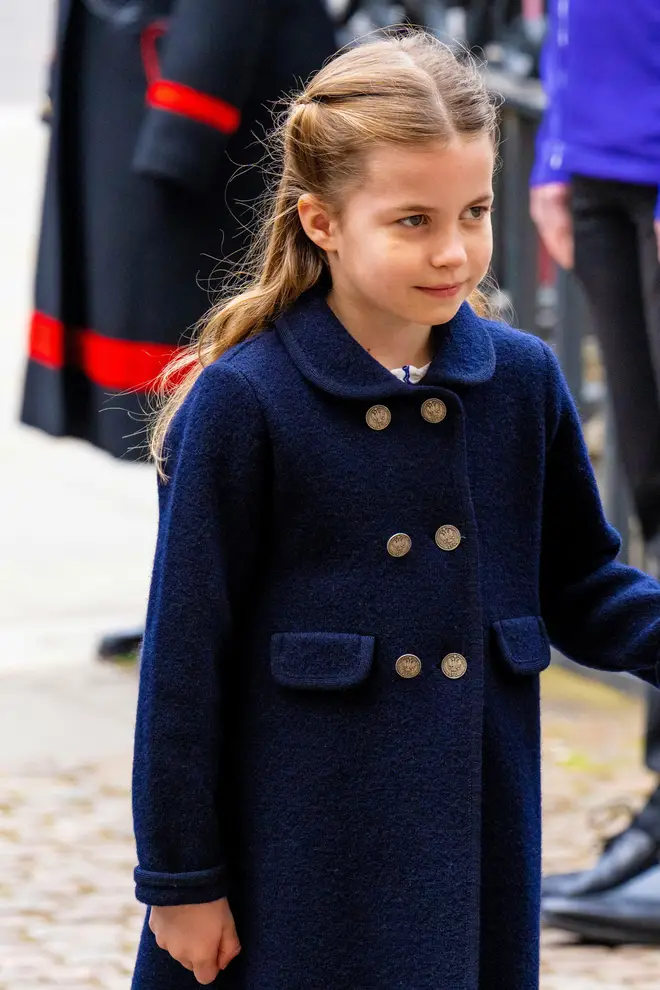 Princess Charlotte in navy coat and gold buttons