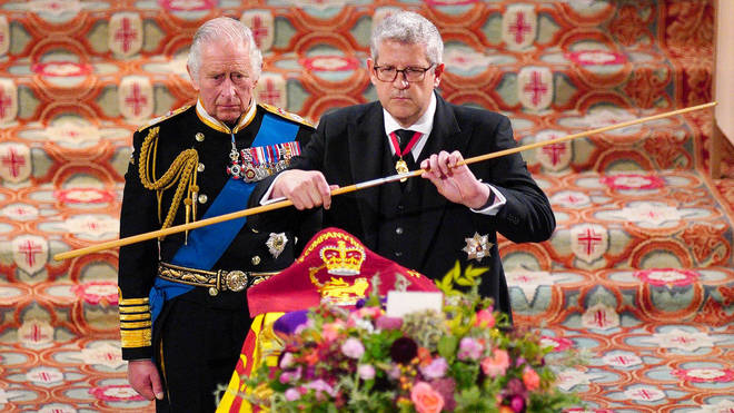 King Charles watches as the Lord Chamberlain breaks his Wand of Office at the Committal Service