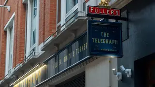 London- The Telegraph pub sign, a Fuller's pub in the city of London