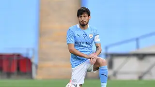 Manchester City’s David Silva takes a knee