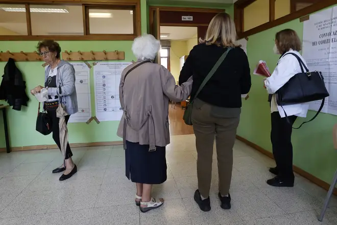 Voters queuing for the general election for the new Parliament in Italy