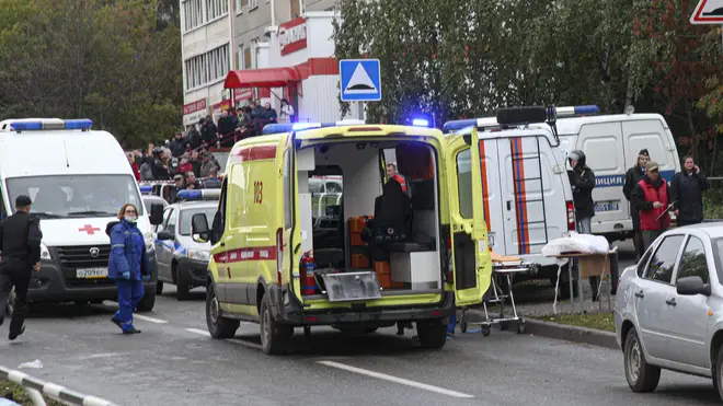 Police and paramedics work at the scene of a shooting at school Number 88 in Izhevsk, Russia