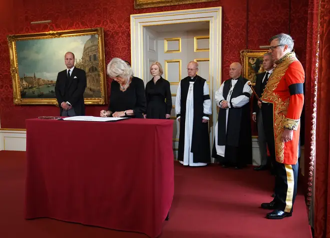 Duke of Norfolk oversees the Queen consort signing the Proclamation of Accession of King Charles III