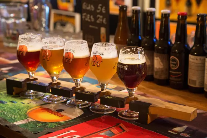 Beer sampler plank with Belgian beers for beer tasting in Flemish café