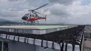 A rescue helicopter prepares to land at a hospital in Kathmandu, Nepal
