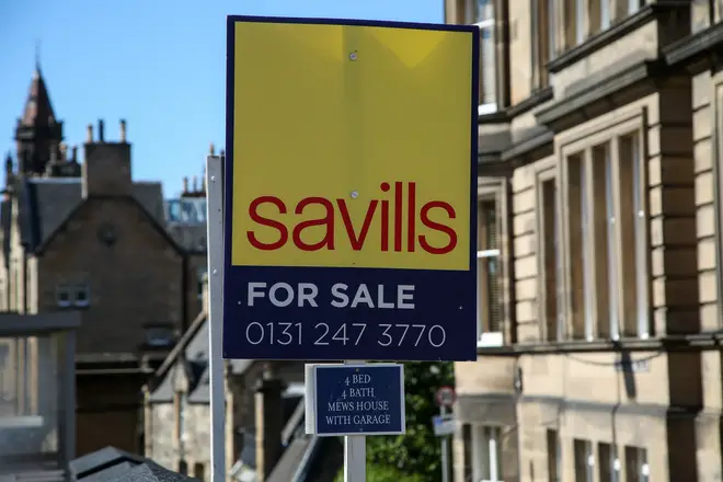 A For Sale Savills estate agent board sign outside...