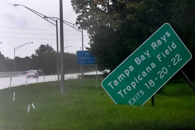 A damaged sign sits on the side of state road I-275.