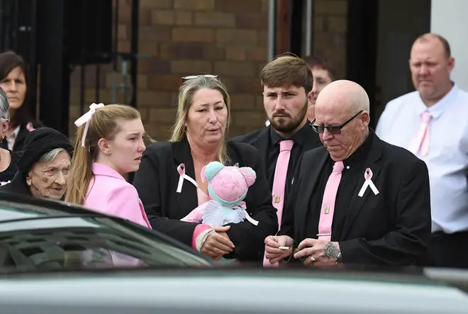 Attendees at Olivia's funeral wore pink ties, jackets, scarves and bows after her family asked people to wear a "splash of pink".