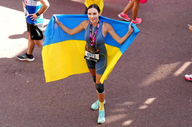 Viktoriia Kiose from the Ukraine celebrates after completing the TCS London Marathon