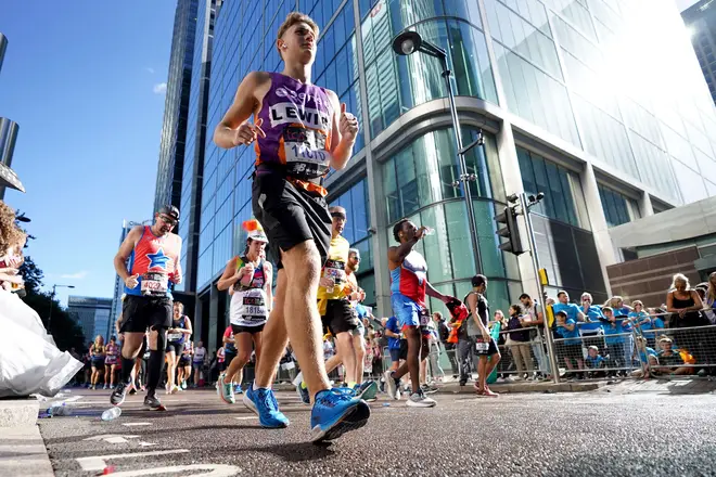 Runners take part, pictured here near Canary Wharf