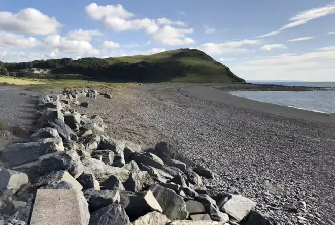 A man in his thirties discovered 30 black packages washed up on a beach, with contents inside which 'looked like pure cocaine'.