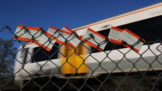 Train tickets placed on a fence