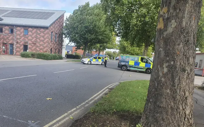 Armed police near the Farm Foods shop in Derby
