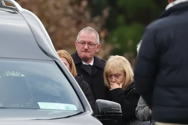 The family of Jessica watch as her coffin leaves St Michael's Church.