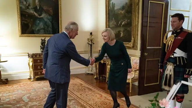 King Charles and Liz Truss shook hands in greeting
