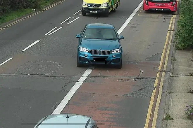 The blue BMW behind the car that was fined